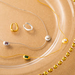 Gold Emerald Crystal Drop Necklace, a chic emerald accent to elevate your style, featuring a crystal drop pendant with a vibrant emerald hue, adding a touch of modern flair to your neckline