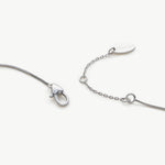 Platinum Crystal Drop Necklace in Sapphire, an enchanting sapphire glow that radiates elegance, featuring a crystal drop pendant in a deep blue hue, creating a timeless and stylish accessory