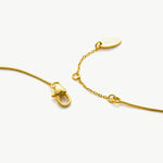 Gold Emerald Crystal Drop Necklace, a chic emerald accent to elevate your style, featuring a crystal drop pendant with a vibrant emerald hue, adding a touch of modern flair to your neckline.