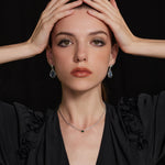 Rectangle Dewdrop Pendant in Emerald, an enchanting emerald glow that radiates elegance, featuring a radiant emerald rectangle dewdrop on a delicate chain, creating a timeless and stylish accessory