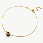 Black Ring Pendant Chain Necklace, a modern and monochrome statement piece, showcasing a black ring pendant on a delicate chain, creating a versatile and chic accessory for any outfit.