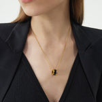 Ring Pendant Chain Necklace in Black, a minimalist and noir-inspired piece, this necklace features a black ring pendant suspended from a dainty chain, creating a subtle and modern accessory for everyday wear