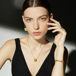 Yellow Ring Pendant Necklace, a modern take on sunshine, this necklace features a yellow ring pendant on a delicate chain, creating a contemporary and stylish accessory for expressing joy and style