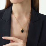 Luxe Black Gleam: Gold Pendant Necklace with Black Agate, with a luxe black gleam, this necklace captures the allure of black agate in a gold setting, adding a touch of opulence and sophistication to your neckline