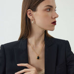 Black Agate Gold Pendant Necklace, a sleek and edgy addition to your jewelry collection, this necklace features a black agate pendant on a gold chain, adding a modern and sophisticated touch to your look.