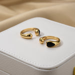 Black Onyx Open Ring with a sculptural touch, a sleek and minimalist choice for a refined and edgy look.