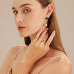 Red Gemstone Open Ring featuring a captivating pearl, a statement piece for a bold and sophisticated look.