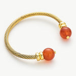 Gold Agate Bracelet adorned with red gemstones, this bracelet radiates with the captivating glow of red agate, adding a touch of radiant beauty to your wrist in a vintage-inspired setting