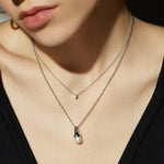 Crystal Pendant Necklace in Platinum, showcasing a platinum pendant that adds a touch of elegance and sophistication to your neckline.