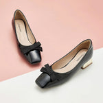 Black Patent Leather Block Heel Pumps, providing a chic and polished look.