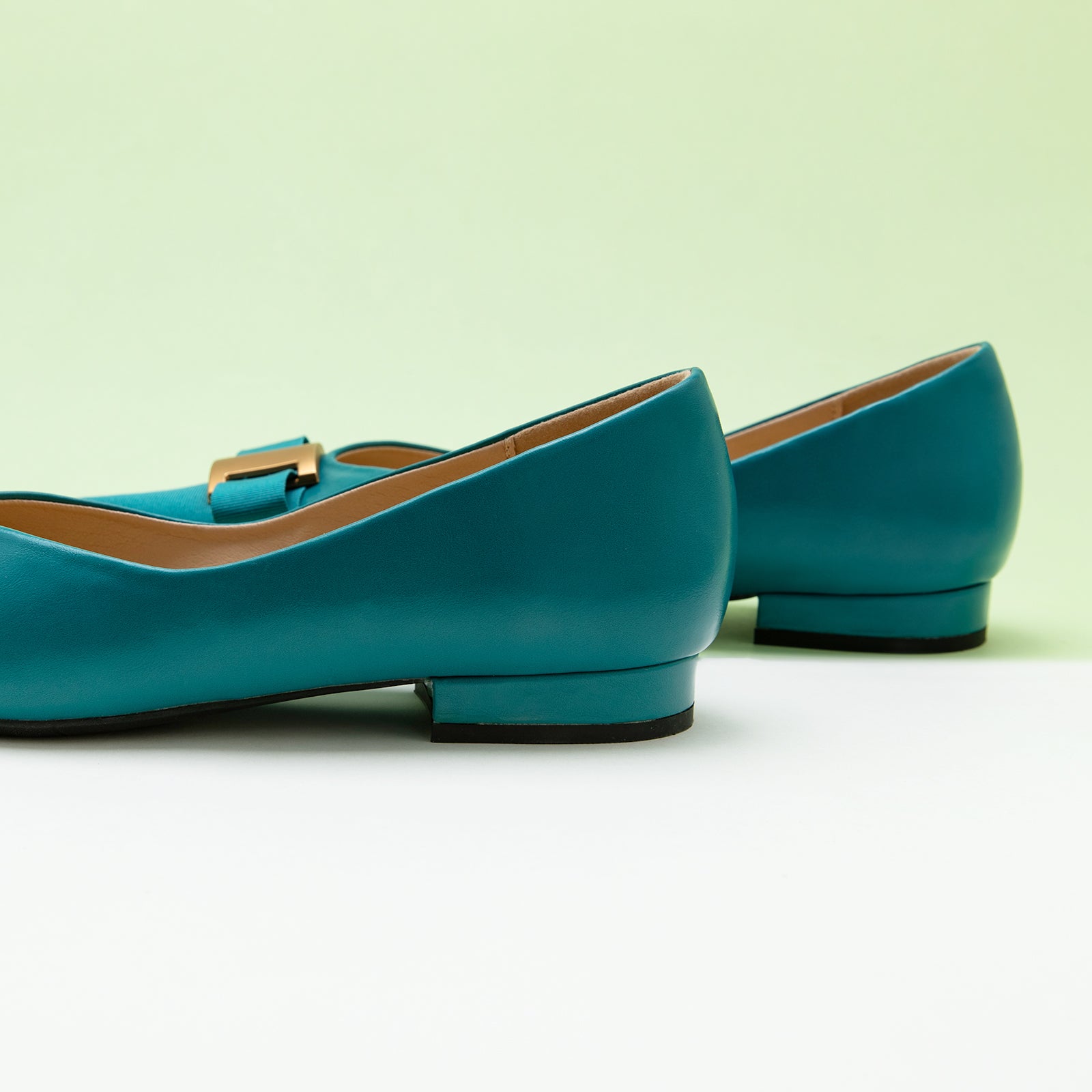 Embellished Leather Flats in Peacock Blue, providing a rich and vibrant touch to your ensemble
