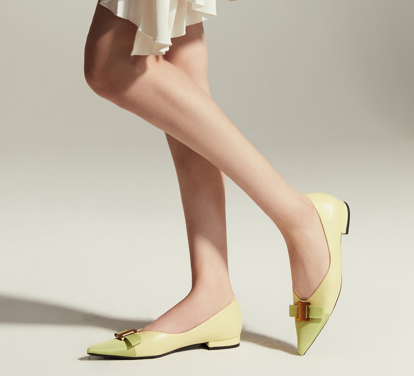 Chic Citrus Charm: Embellished Leather Flats in Yellow, offering a trendy and fashionable touch to your ensemble