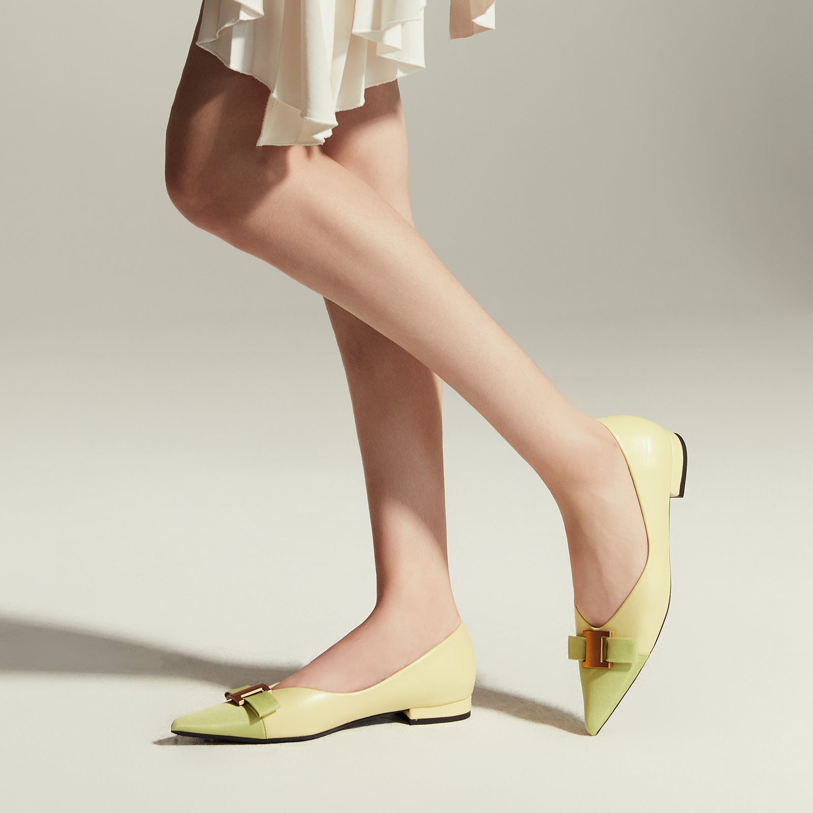 Chic Citrus Charm: Embellished Leather Flats in Yellow, offering a trendy and fashionable touch to your ensemble