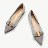 Grey leather flats adorned with stylish embellishments for a touch of sophistication
