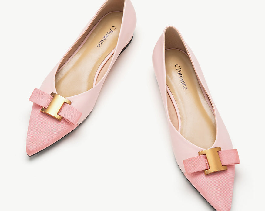 Pink leather flats adorned with stylish embellishments for a touch of elegance