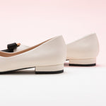 Clean and Crisp: White Embellished Leather Flats, a fresh and versatile choice for a modern and chic look