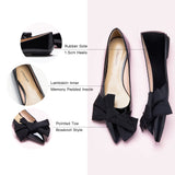 Embrace classic and versatile style with these black off-center flats, featuring a charming bow embellishment for a timeless look