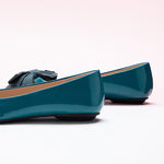 Fashionable blue Bow-Embellished Flats with an off-center design, a trendy and unique look