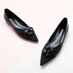 Elegant Black Leather Flats with Camellia Embellishment.