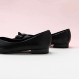 Black Camellia Soft Leather Flats: Timeless Style.