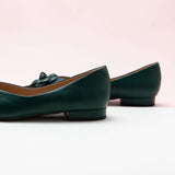 Elegant Green Leather Flats with Camellia Embellishment.