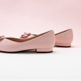Elegant Pink Leather Flats with Camellia Embellishment.