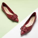 Grain Leather Point Toe Flats in a bold and vibrant red hue, making a confident and stylish statement