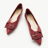 Elegant red point-toe flats in luxurious grain leather