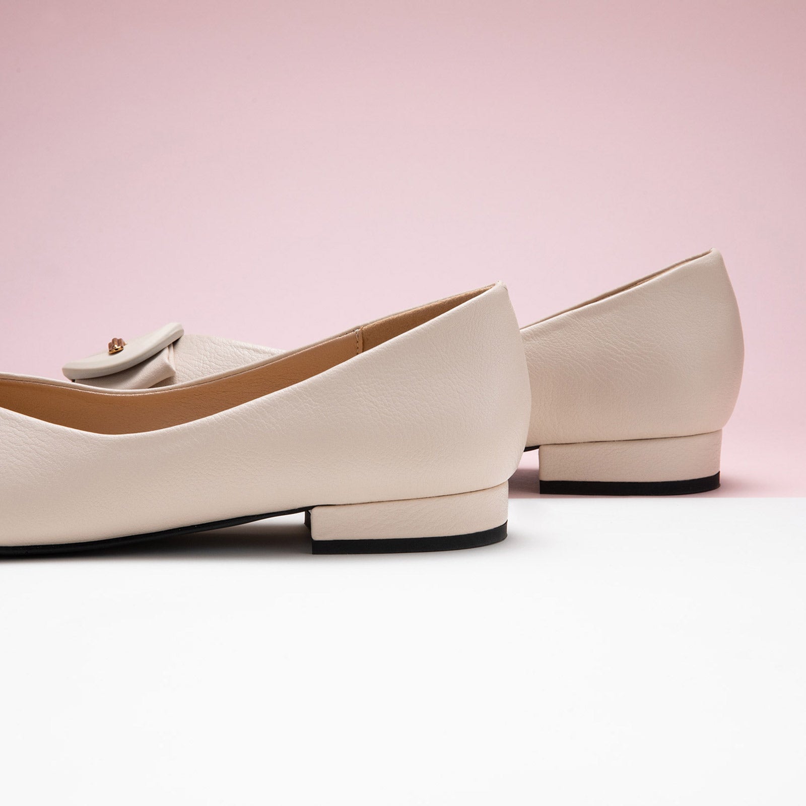 Grain Leather Point Toe Flats in White, providing a clean and contemporary touch to your ensemble