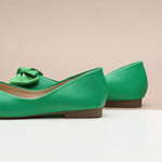  Stay on-trend with these fashion-forward square-toe flats in a trendy green shade, showcasing a playful bowknot detail and crafted from soft, supple leather for both style and comfort.