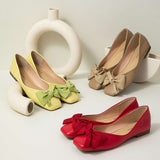 Vibrant green flats with a square toe and a dainty bowknot, fashioned from sumptuous soft leather for a touch of sophistication.