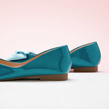 Women's footwear in stunning peacock blue with a trendy bowknot detail.