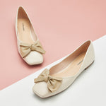 Step into sophistication with these timeless white leather square-toe flats, complete with a graceful bowknot accent for a classic and versatile footwear choice.