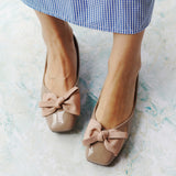 Make a chic statement with these dark beige flats showcasing a square design and a delicate bowknot, adding a touch of modern elegance to your ensemble