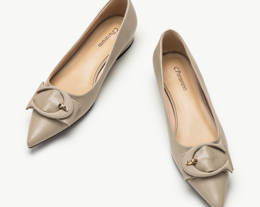 Close-up of Camel-colored C Buckled Pointed Toe Flats