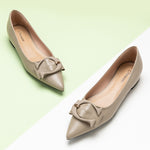 Pair of stylish pointed toe flats in a rich Camel hue with prominent buckles