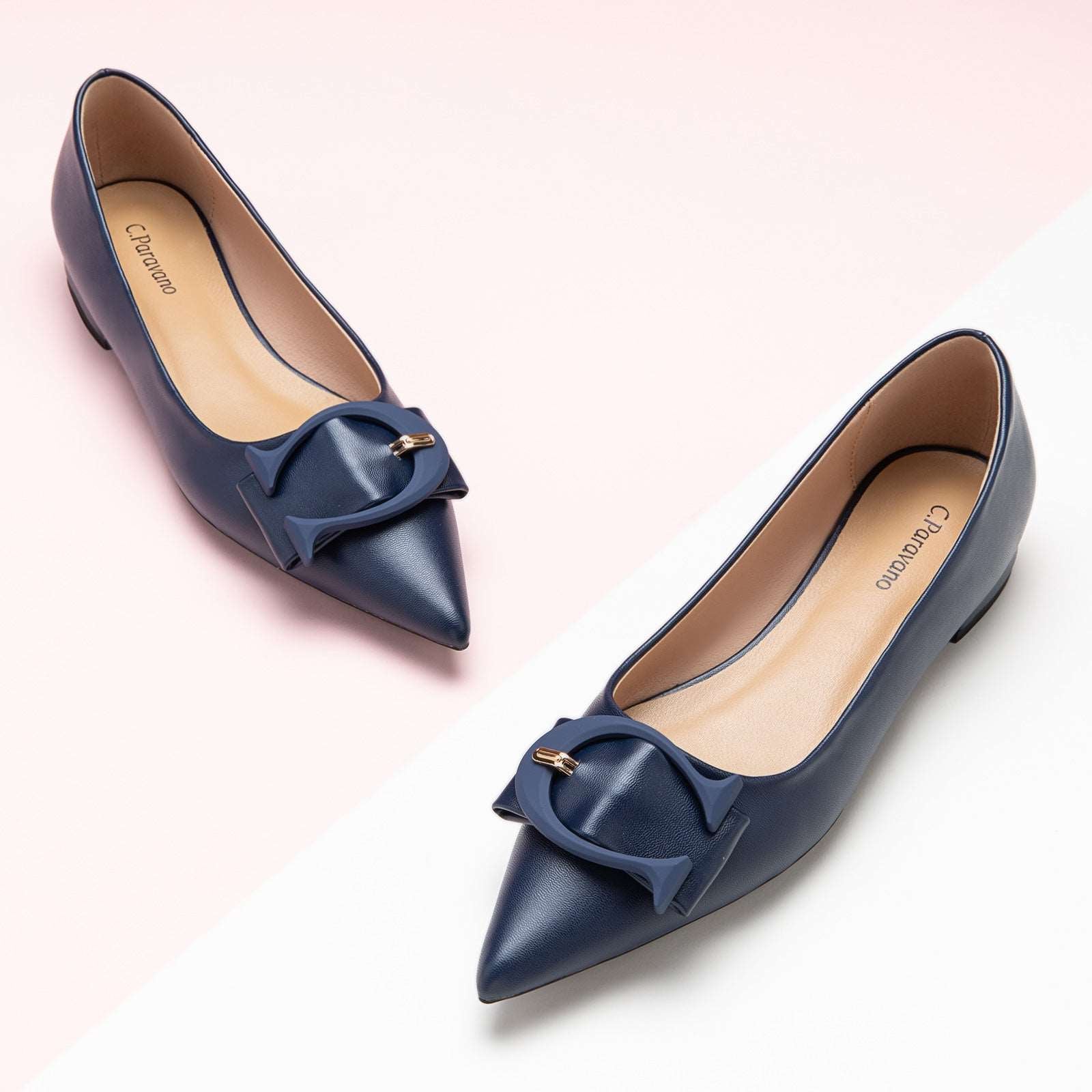 Classic navy pointed toe flats with a chic C buckle detail – a timeless and versatile choice for any wardrobe.