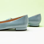 Metal Buckle Flats in Blue with a pointed toe, adding a touch of modernity and style to your ensemble