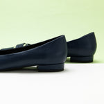  Navy Soft Leather Flats with a Metal Buckle and Pointed Toe, a chic and timeless choice for elevating your ensemble with a rich and deep color