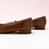  Brown Trapezoidal Buckle Flats, perfect for a confident and fashionable look in any urban setting.