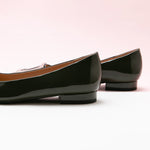 Dark Green Trapezoidal Buckle Flats, perfect for a confident and fashionable look in any urban setting.