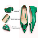 Flats in Green with a trapezoidal buckle, offering a chic and modern option for city living