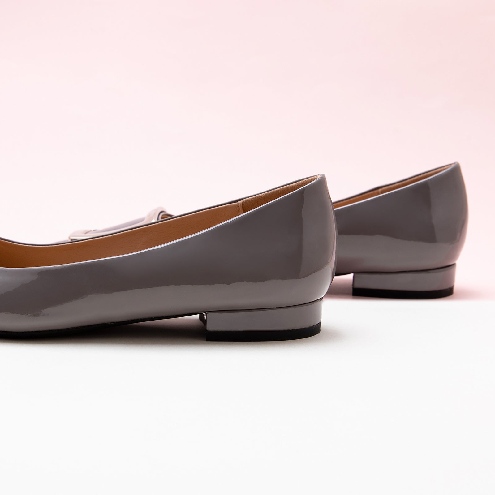 Grey Trapezoidal Buckle Flats, perfect for a confident and fashionable look in any urban setting