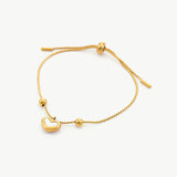 Gold Shell Drop Bracelet, adorned with gilded shells, this bracelet combines the warmth of gold with the natural beauty of shells, creating a radiant and stylish accessory for both casual and dressy occasions
