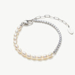 Pearl Crystal Chain Bracelet in Platinum, exuding timeless elegance with a delicate platinum chain adorned with lustrous pearls and sparkling crystals, this bracelet offers a luxurious and refined accessory