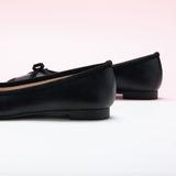Black Toe Bowknot Ballet Flats in Suede, perfect for a confident and fashionable look in any urban setting