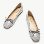 Elegant grey suede ballet flats with a delicate bowknot detail
