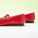 Red Suede Ballet Flats with a charming bow detail, a playful and feminine option for a statement look