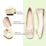 Ivory Ballet Flats with a silky bowknot, perfect for a confident and fashionable look in any urban setting