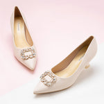 Effortless Elegance: Embellished White Kitten Heel Pumps with a stylish buckle, featuring refined details for a polished and sophisticated style